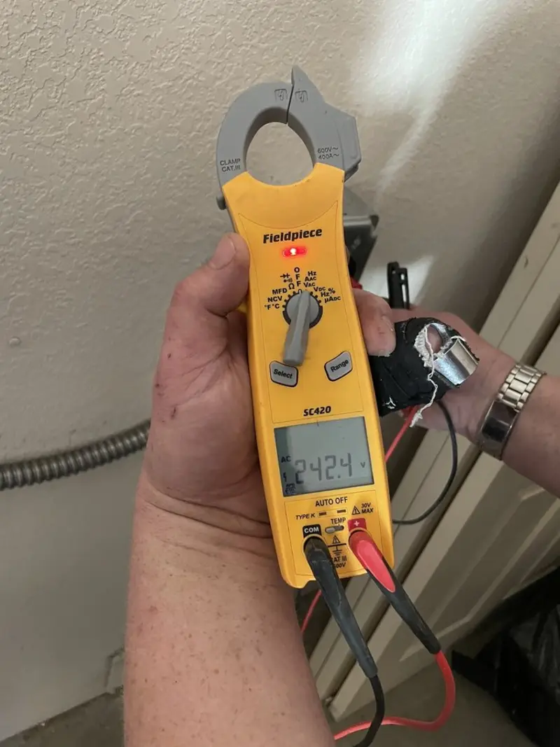 Voltage testing with clamp meter during Ceiling Fan Installation in Waynesville